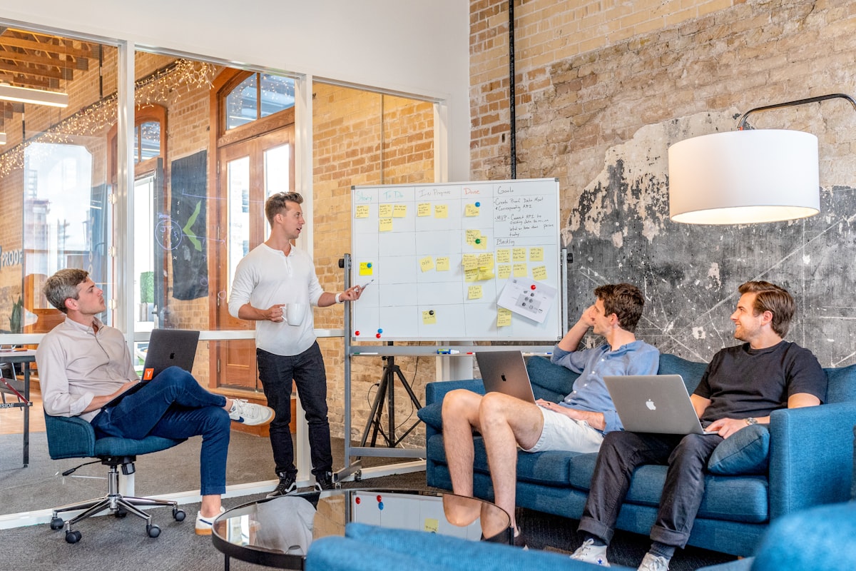 Consultant presenting a structured remote operations plan to a small team